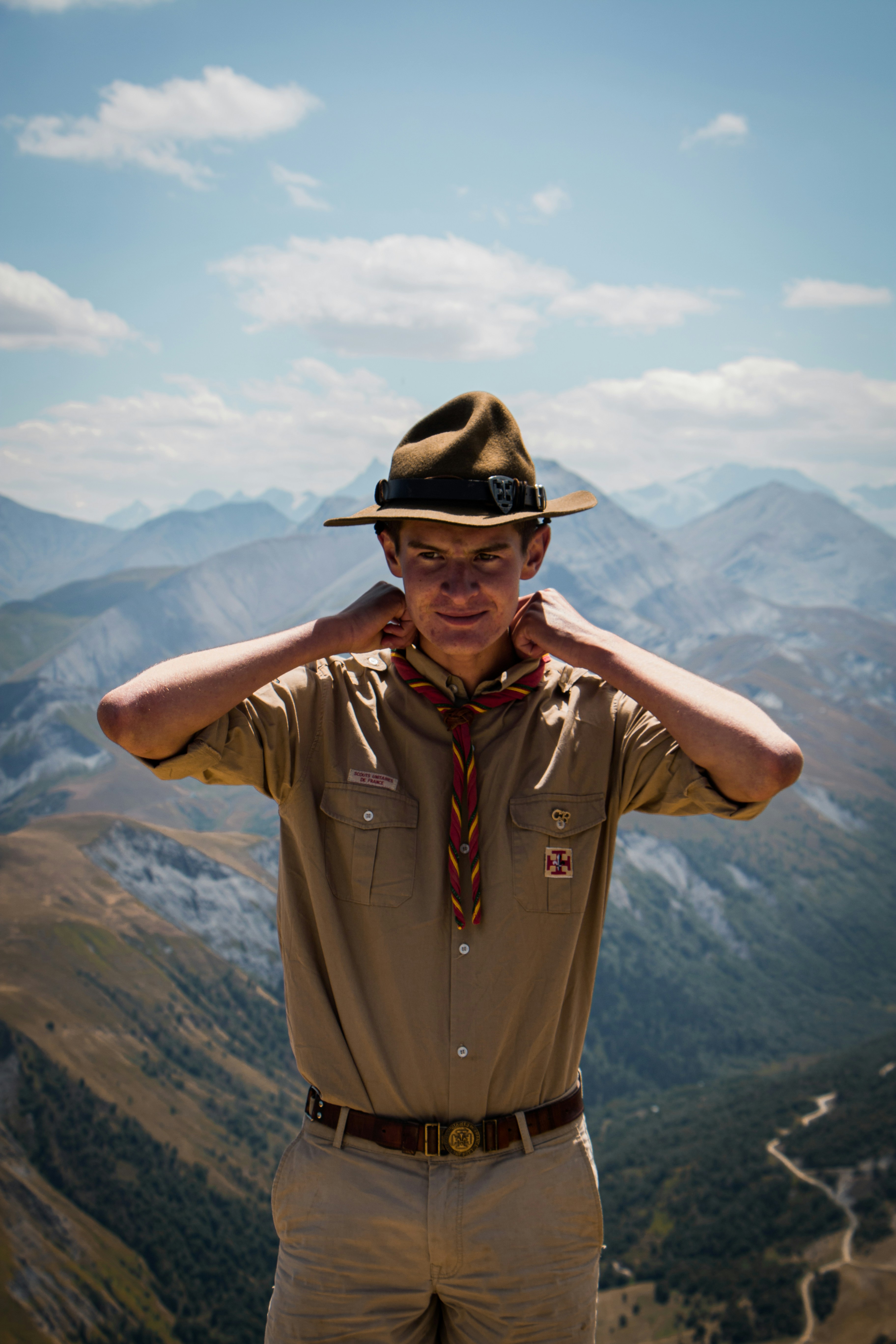 a man wearing a hat and sunglasses