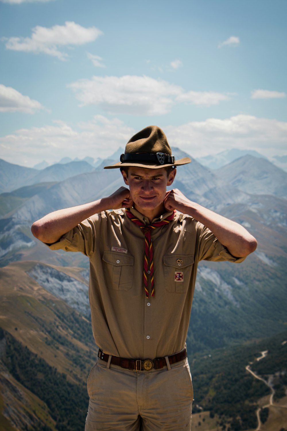 a man wearing a hat and sunglasses