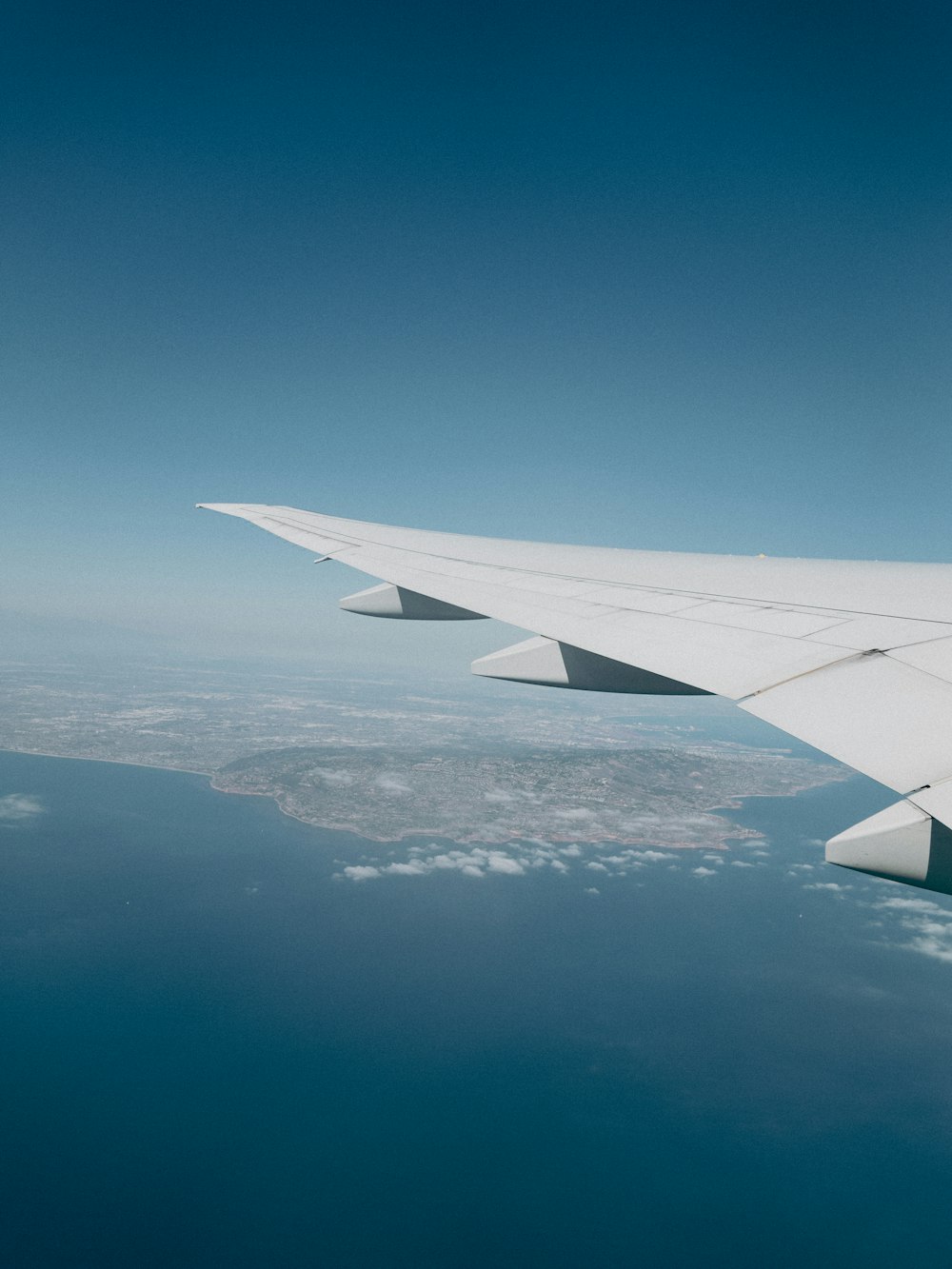 an airplane wing in the sky