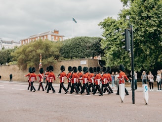 a group of people in red uniforms marching in a parade