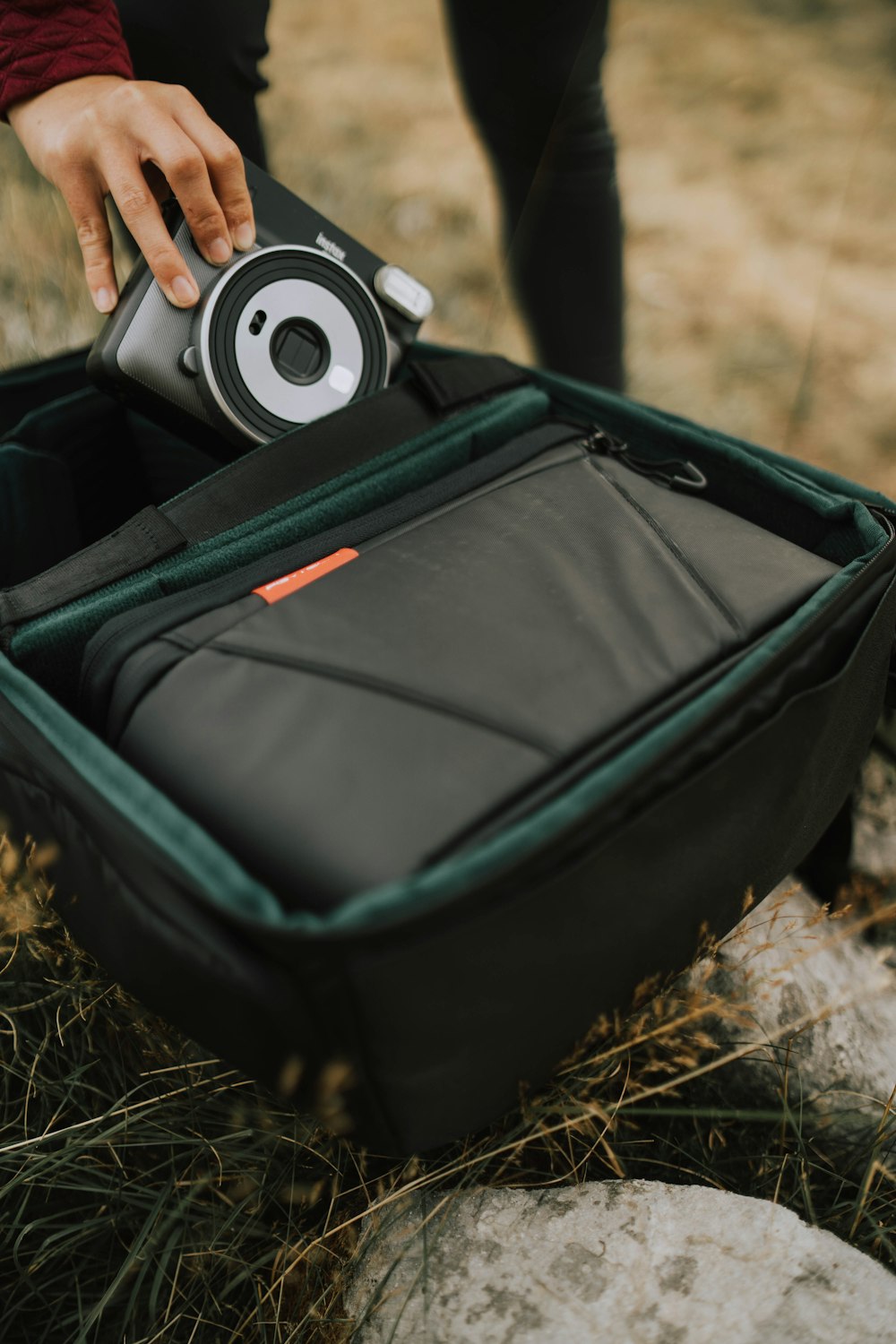 a person holding a suitcase