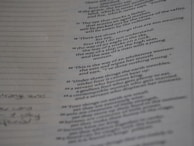 A page from a book or document featuring various numbered textual entries. The text is black and printed on an off-white or greyish paper. Some handwritten notes appear in the left margin, with dotted lines for additional writing.