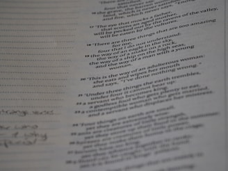 A page from a book or document featuring various numbered textual entries. The text is black and printed on an off-white or greyish paper. Some handwritten notes appear in the left margin, with dotted lines for additional writing.