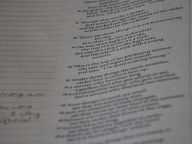 A page from a book or document featuring various numbered textual entries. The text is black and printed on an off-white or greyish paper. Some handwritten notes appear in the left margin, with dotted lines for additional writing.