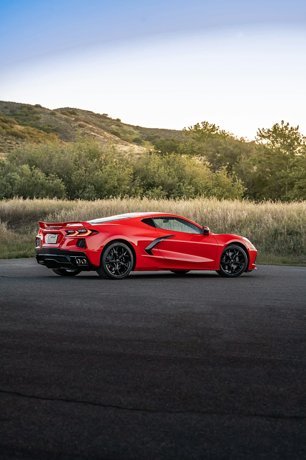 a red sports car on a road