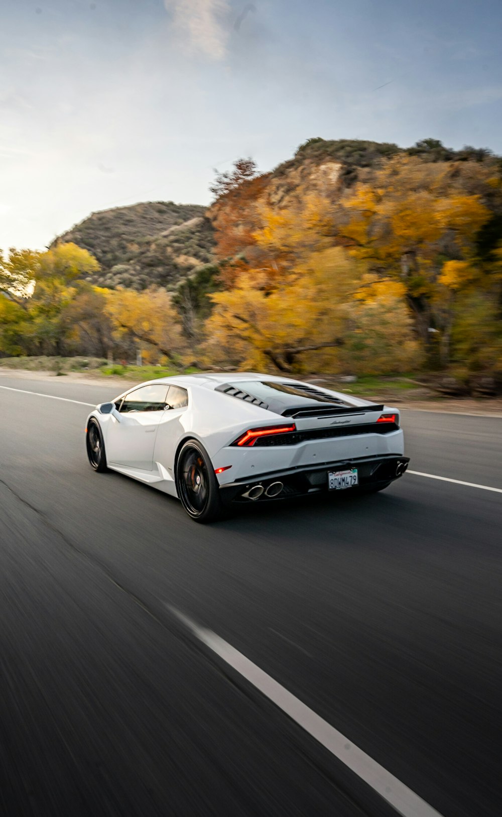 a white sports car on a road