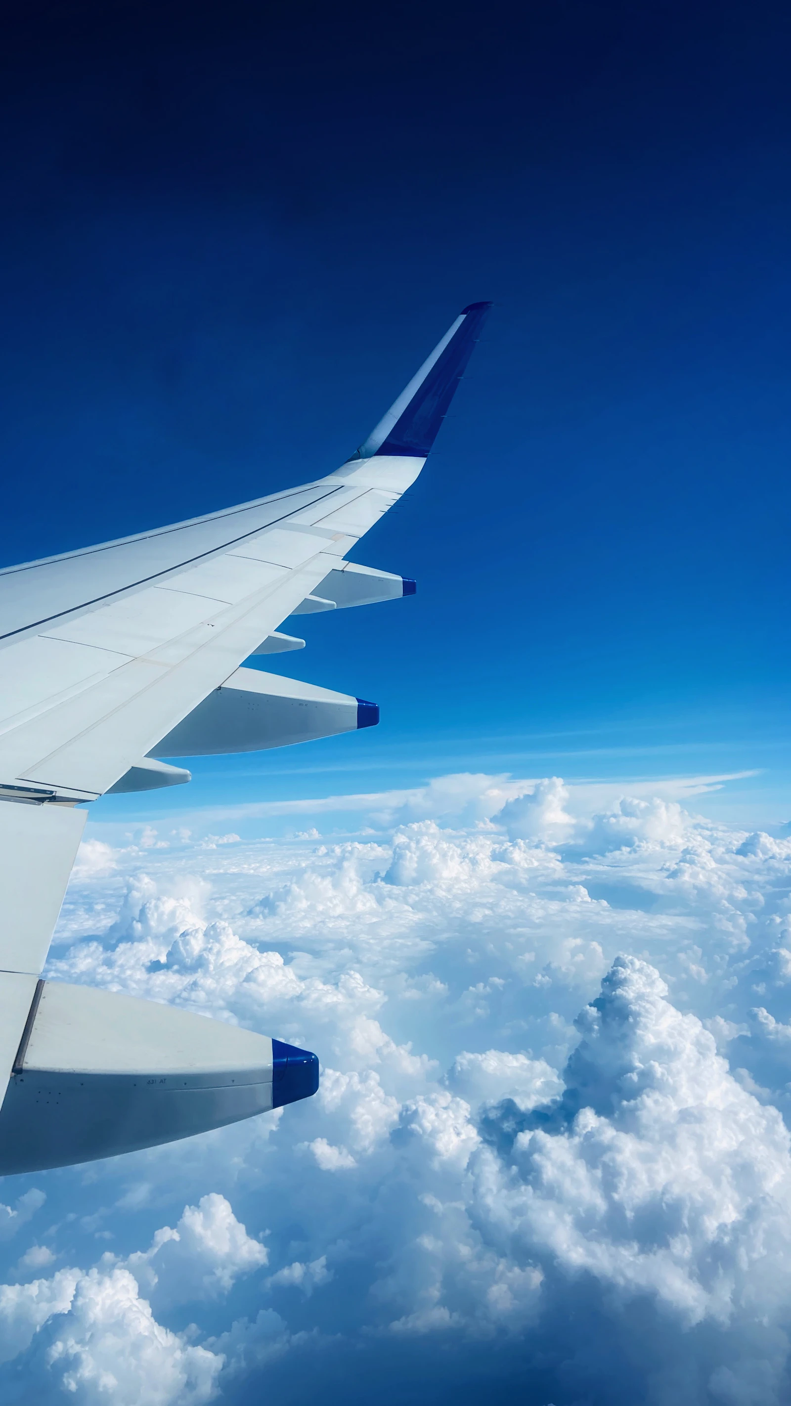 Airplane above clouds for international travel