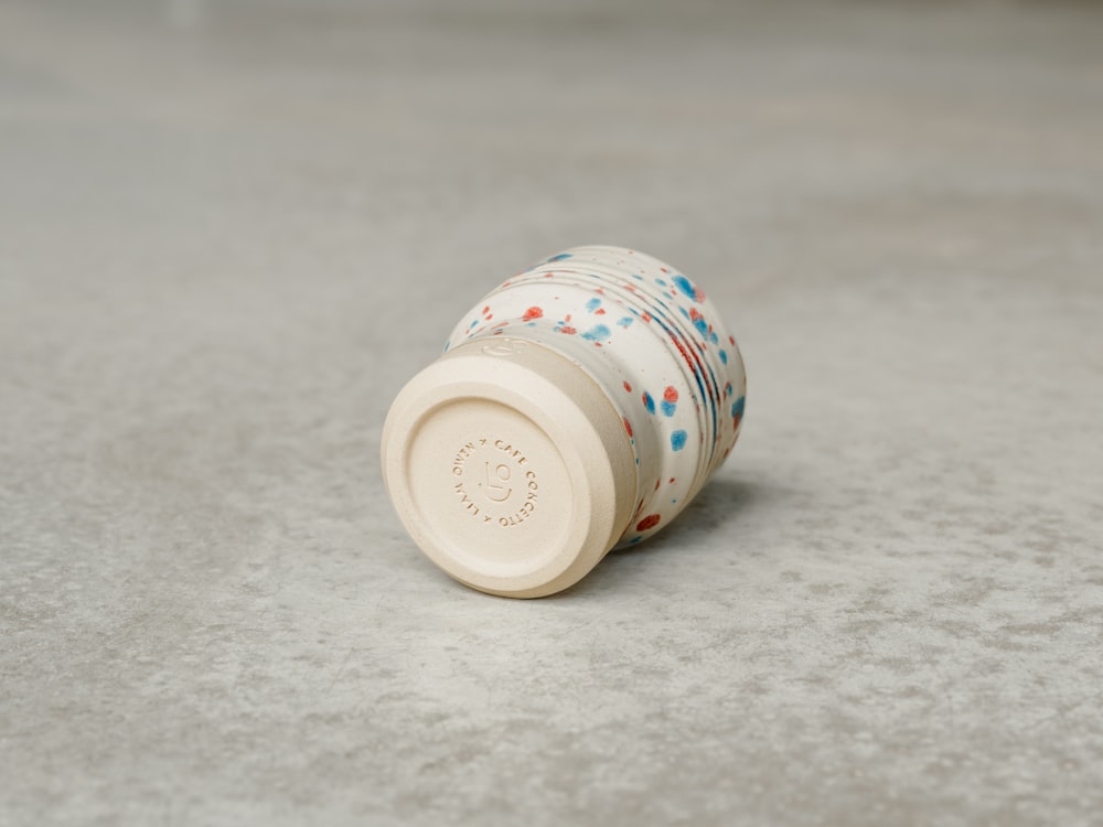 a round white object with a blue and white design on it