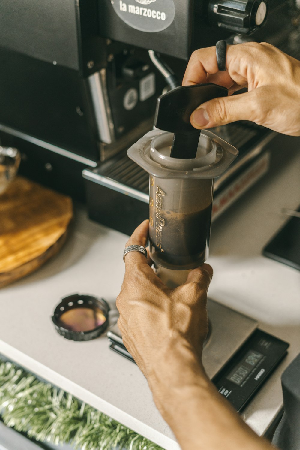 a person holding a coffee cup