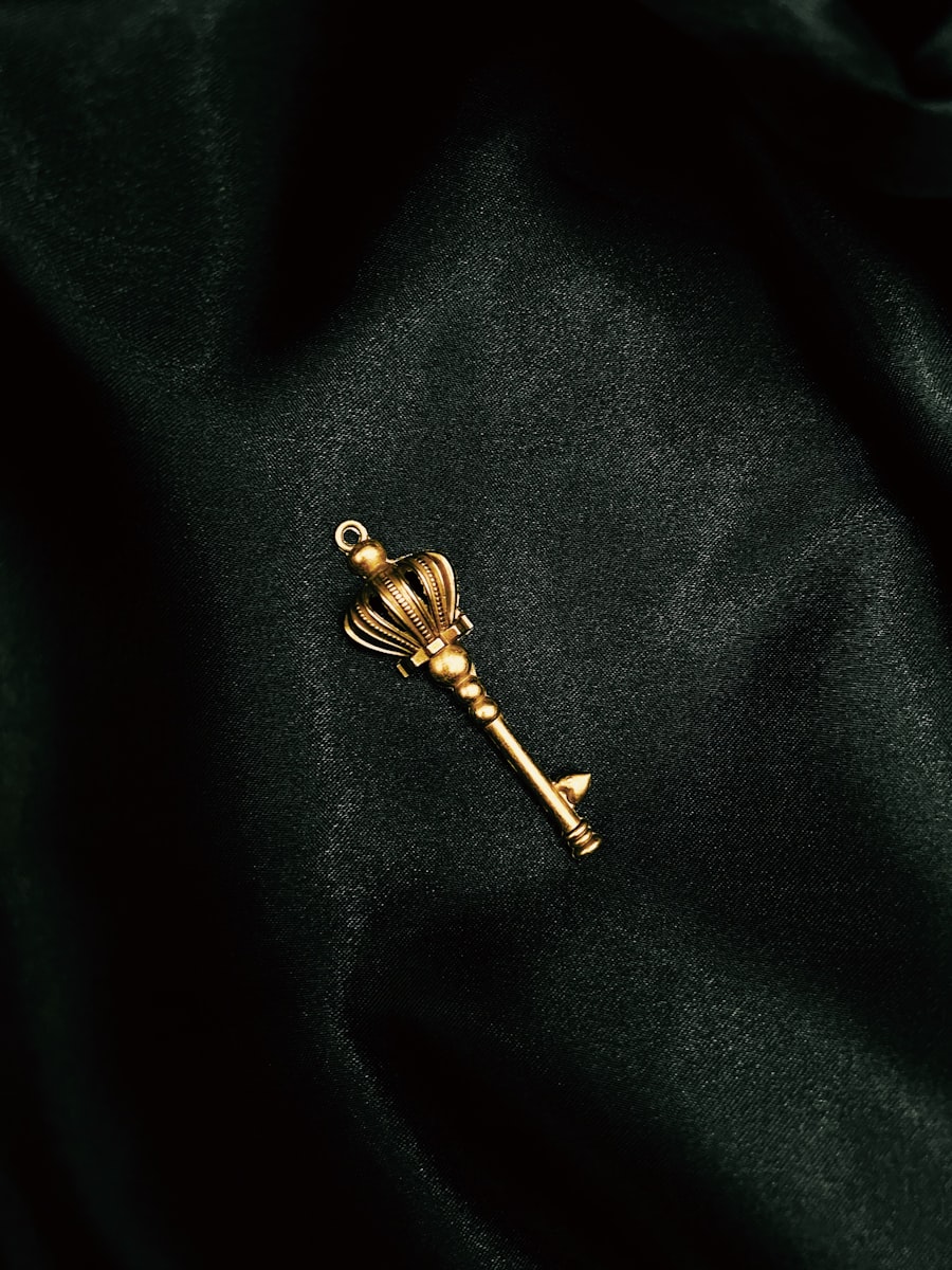 A gold key on a black surface