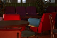 Comfortable lounge space with colorful seating and plants.