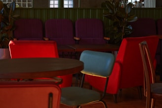 Comfortable lounge space with colorful seating and plants.