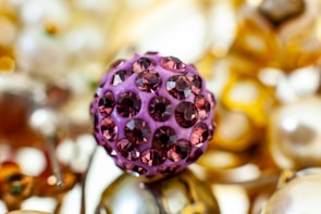 A close-up of a fantasy accessory featuring soft shadows and subtle reflections on a deep purple backdrop.