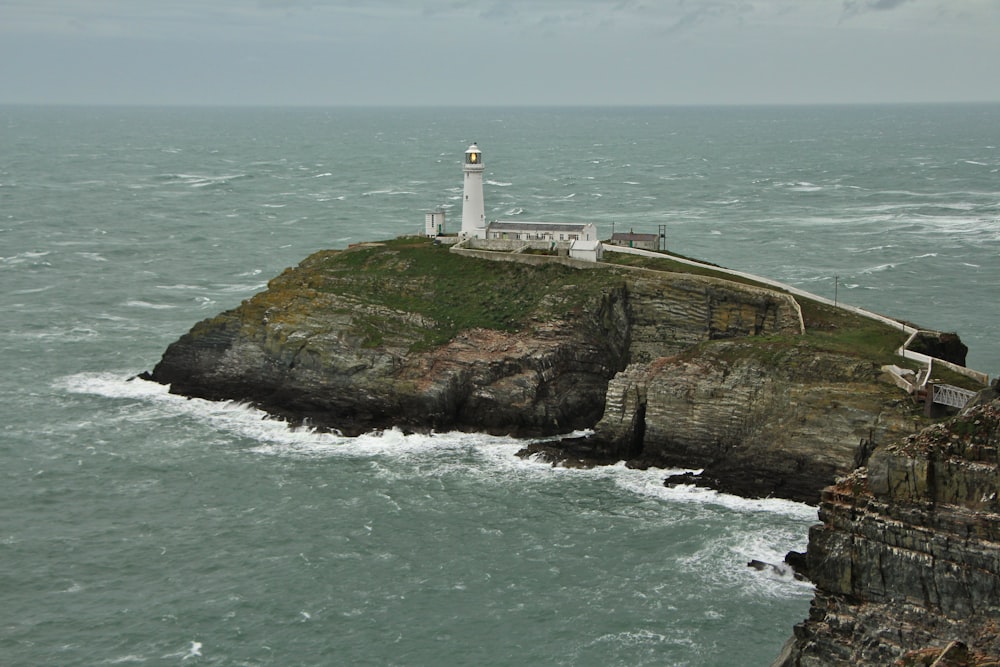 a lighthouse on a rocky island