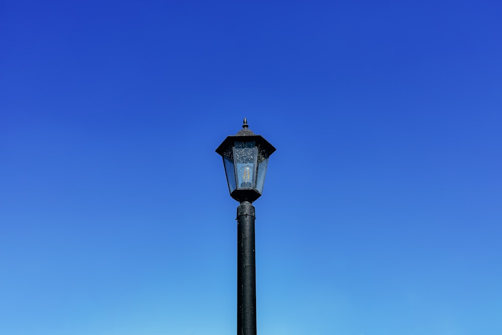 a light post against a blue sky