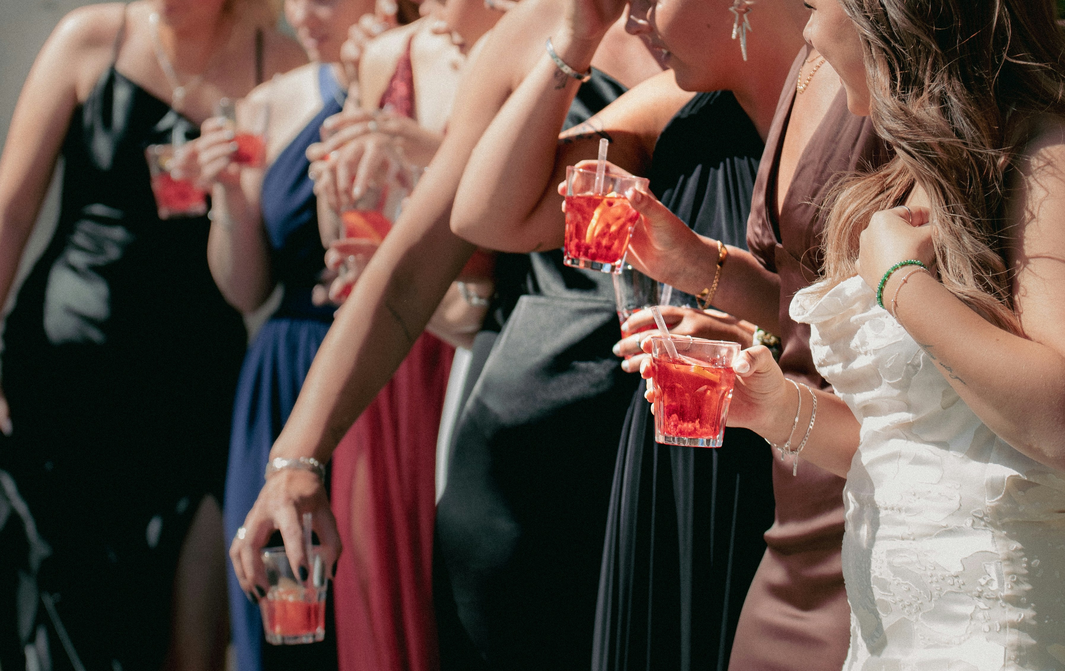 a group of women drinking from glasses