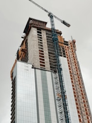 a crane lifting a building
