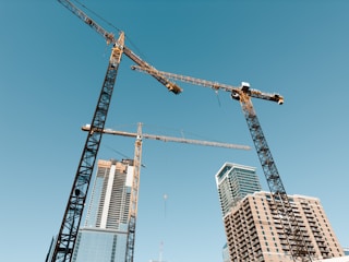 a crane next to a building