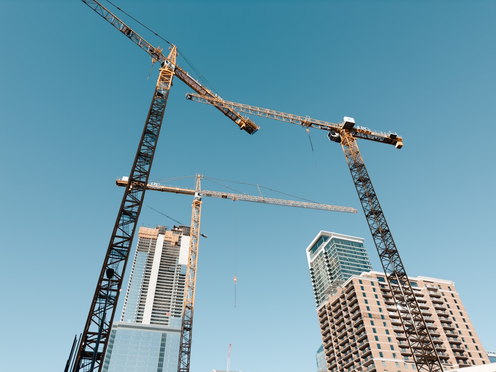 a crane next to a building