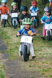 a group of kids on a motorcycle