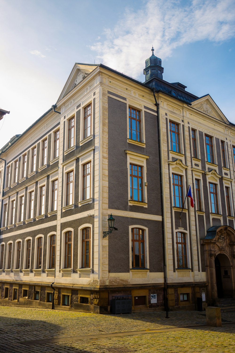 a building with flags on the roof