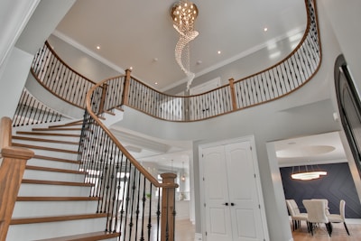 a staircase with a chandelier