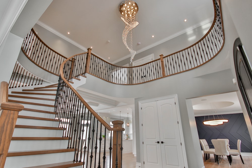 a staircase with a chandelier