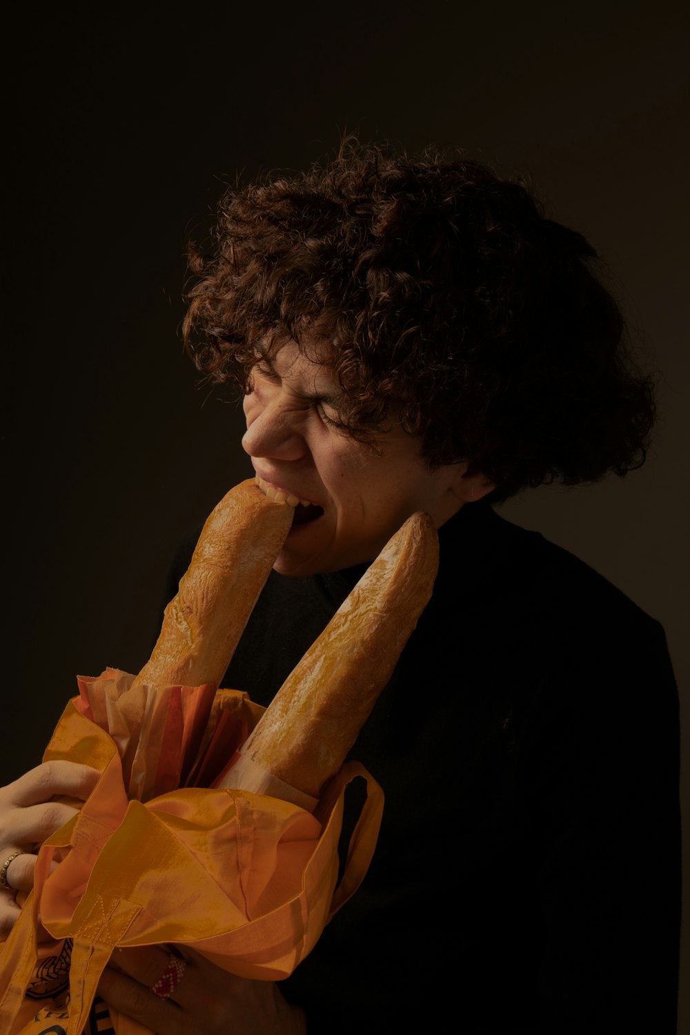 a man eating a bag of chips