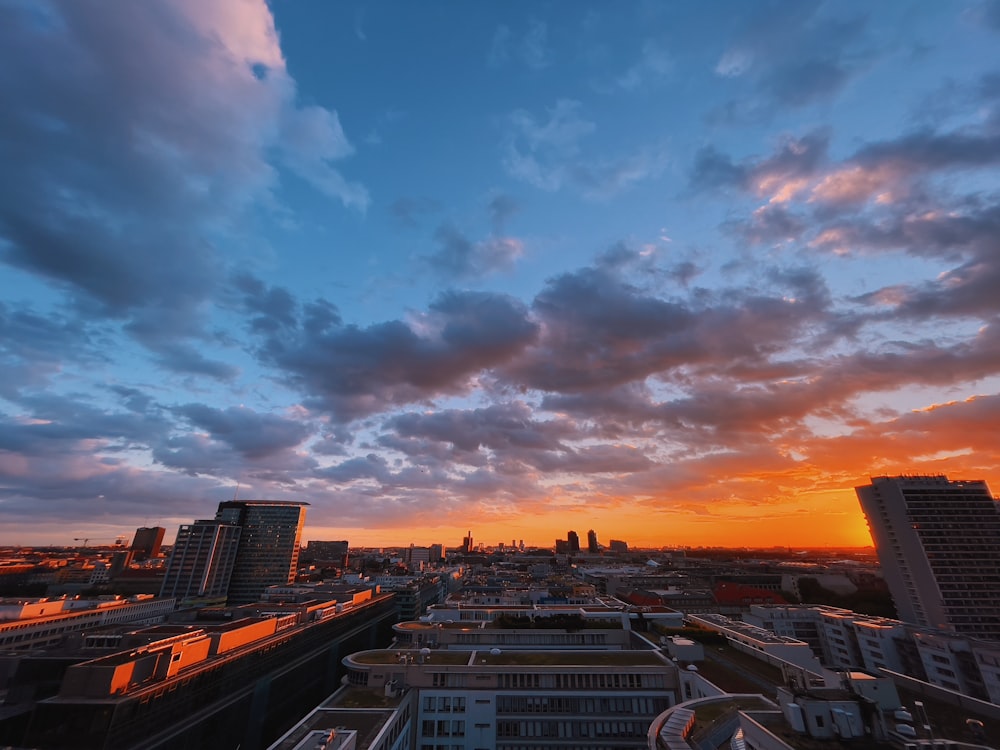 a city with buildings and a sunset