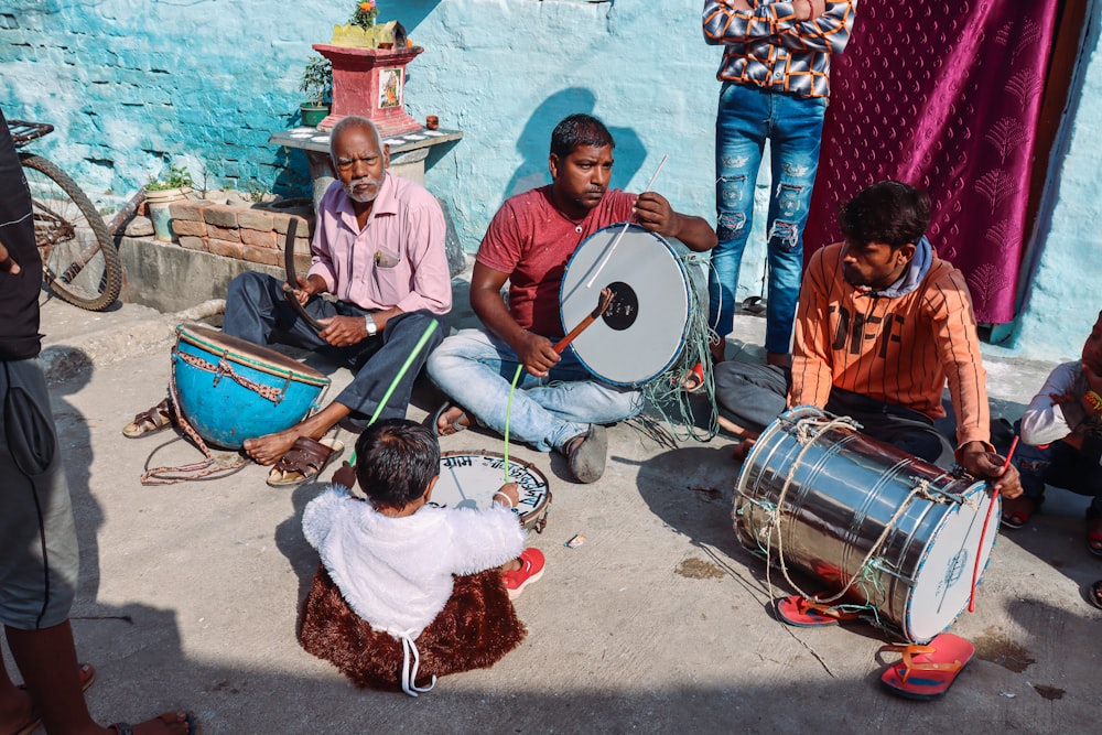 a group of people playing drums