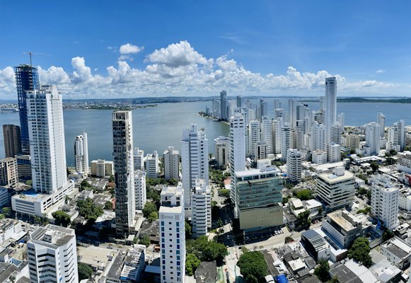 A city with tall buildings and a body of water in the background — Cartagena, Colombia