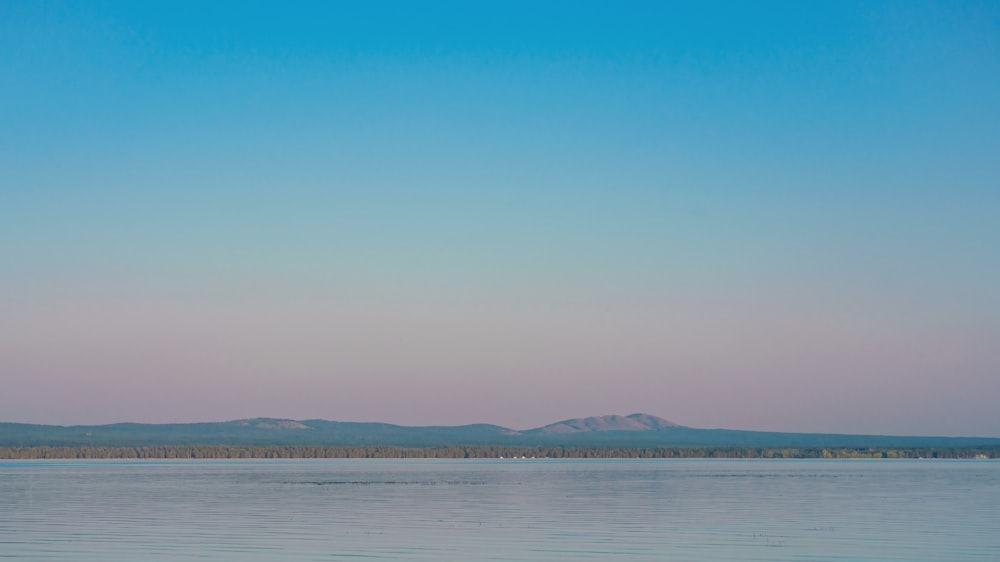 a body of water with land in the distance