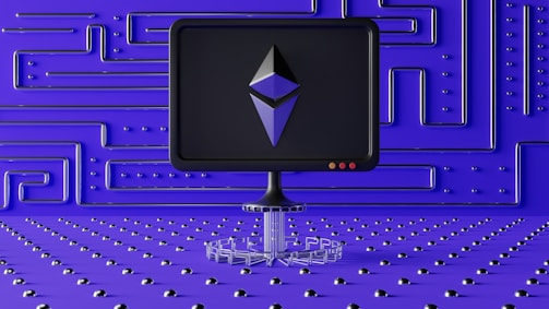A dark computer screen displays a geometric shape resembling a logo, set against a futuristic blue wall with a maze-like pattern of raised lines and dots. The foreground features a base made of connected hexagons, adding to the high-tech aesthetic.