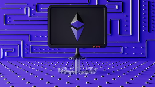 A dark computer screen displays a geometric shape resembling a logo, set against a futuristic blue wall with a maze-like pattern of raised lines and dots. The foreground features a base made of connected hexagons, adding to the high-tech aesthetic.