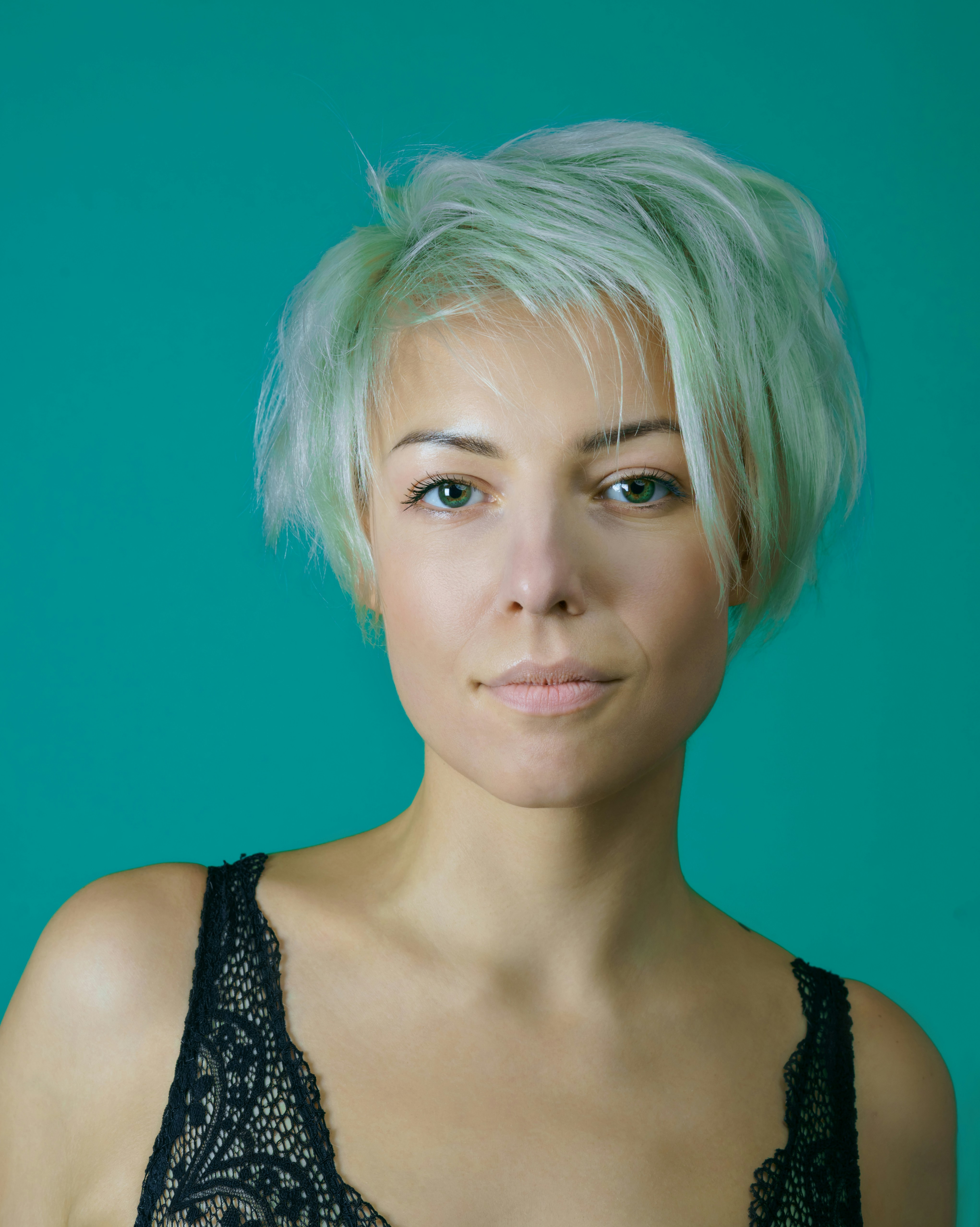 a woman with wispy bixie haircut
