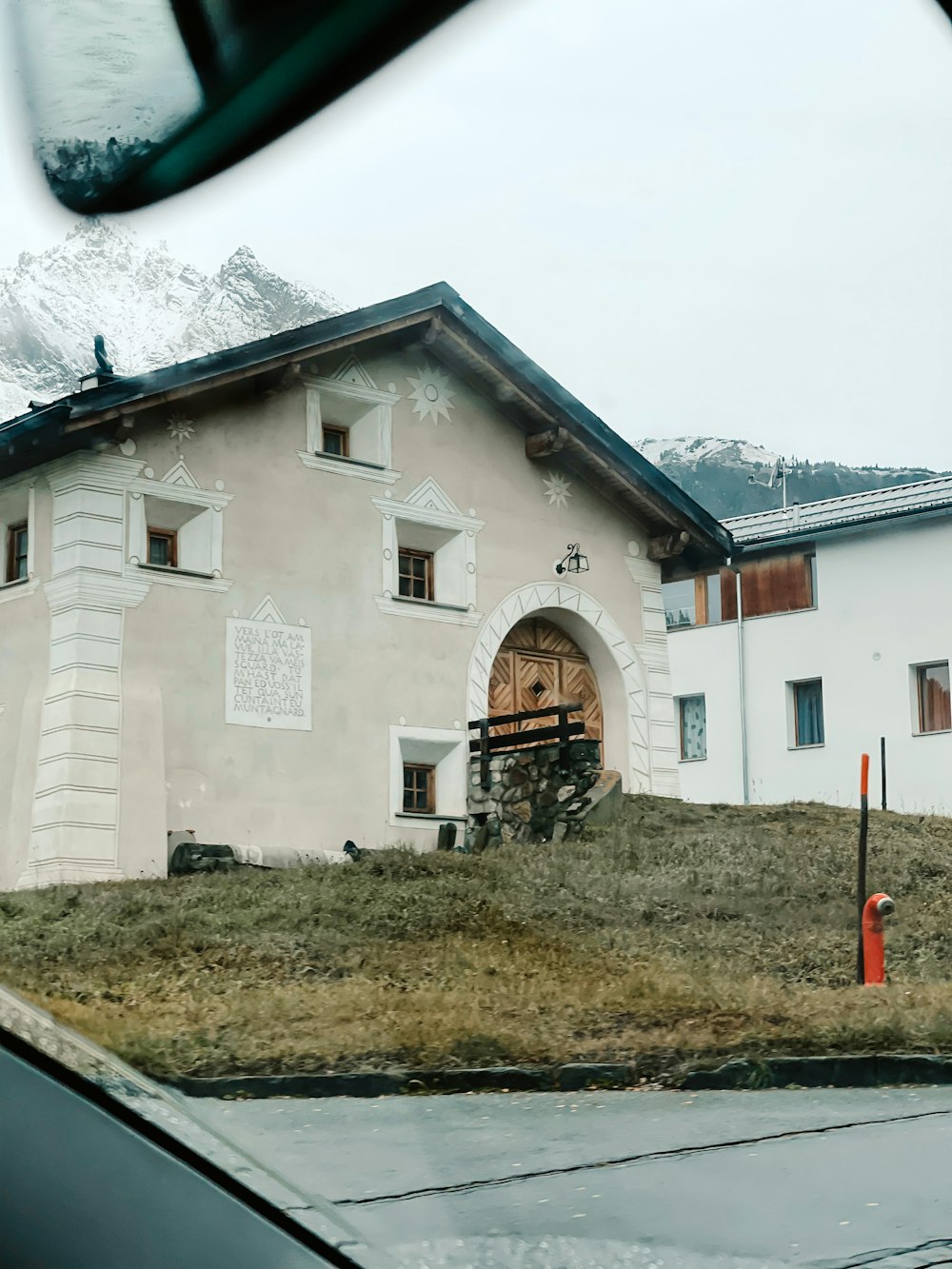 a white building with a large arched doorway