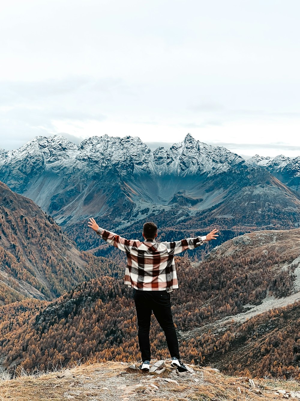 a person standing on a mountain