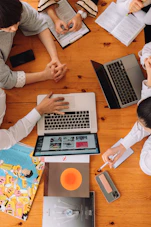 a group of people working on laptops