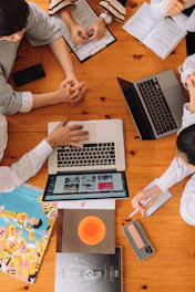 a group of people working on laptops
