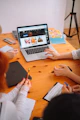 a group of people working on a laptop