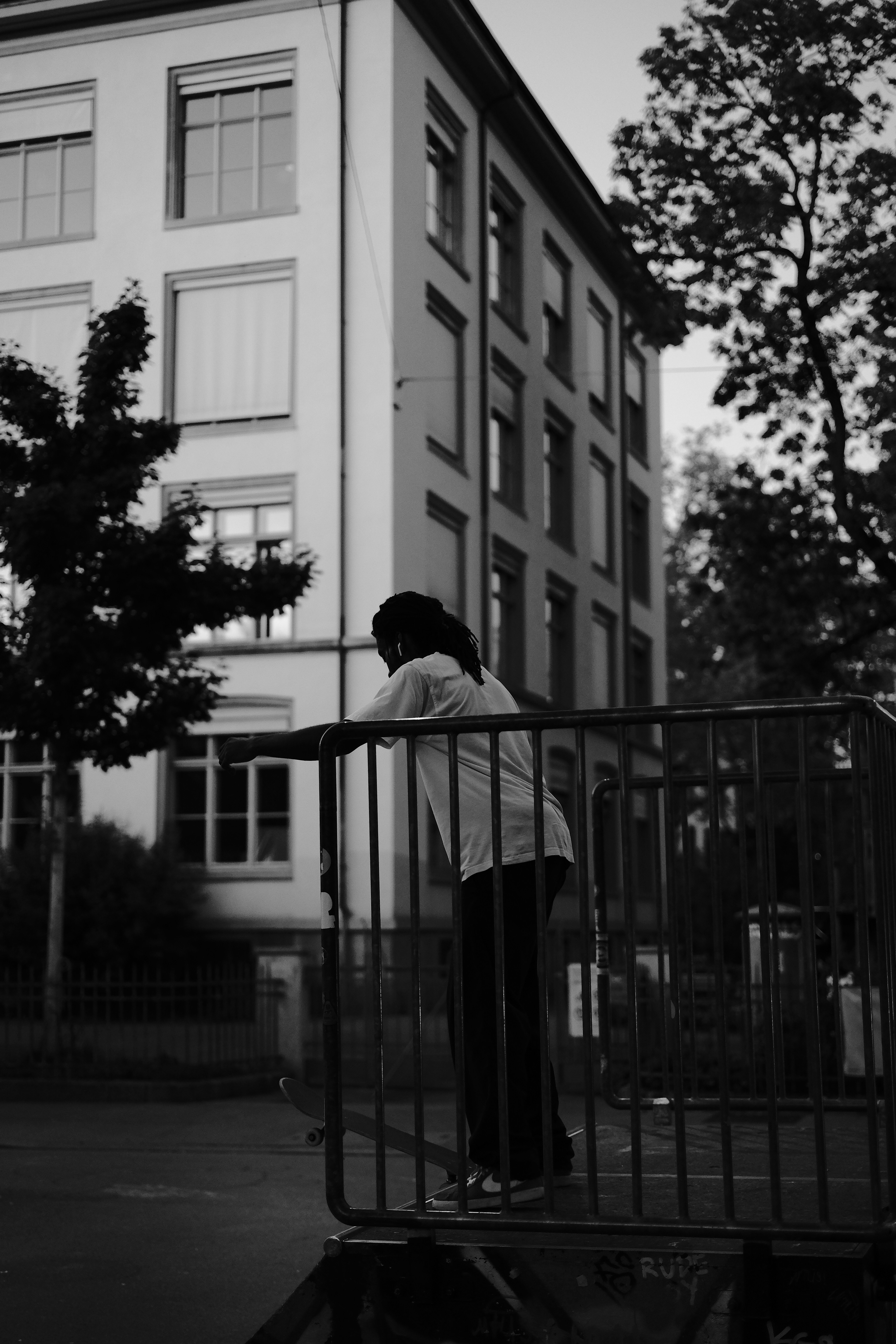 A person leaning on a railing photo – Free Zürich Image on Unsplash