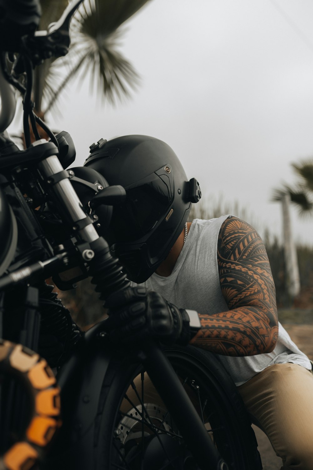a person wearing a helmet and riding a motorcycle