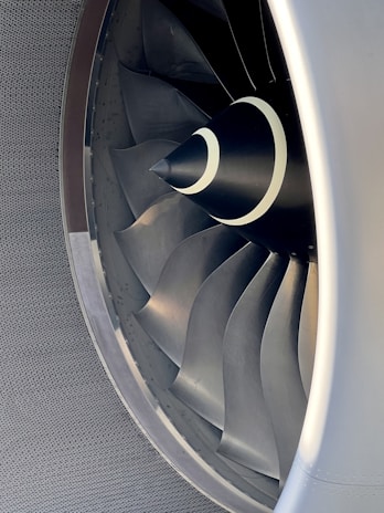 Close-up of a sleek Ark aircraft engine highlighting its advanced turbine blades.