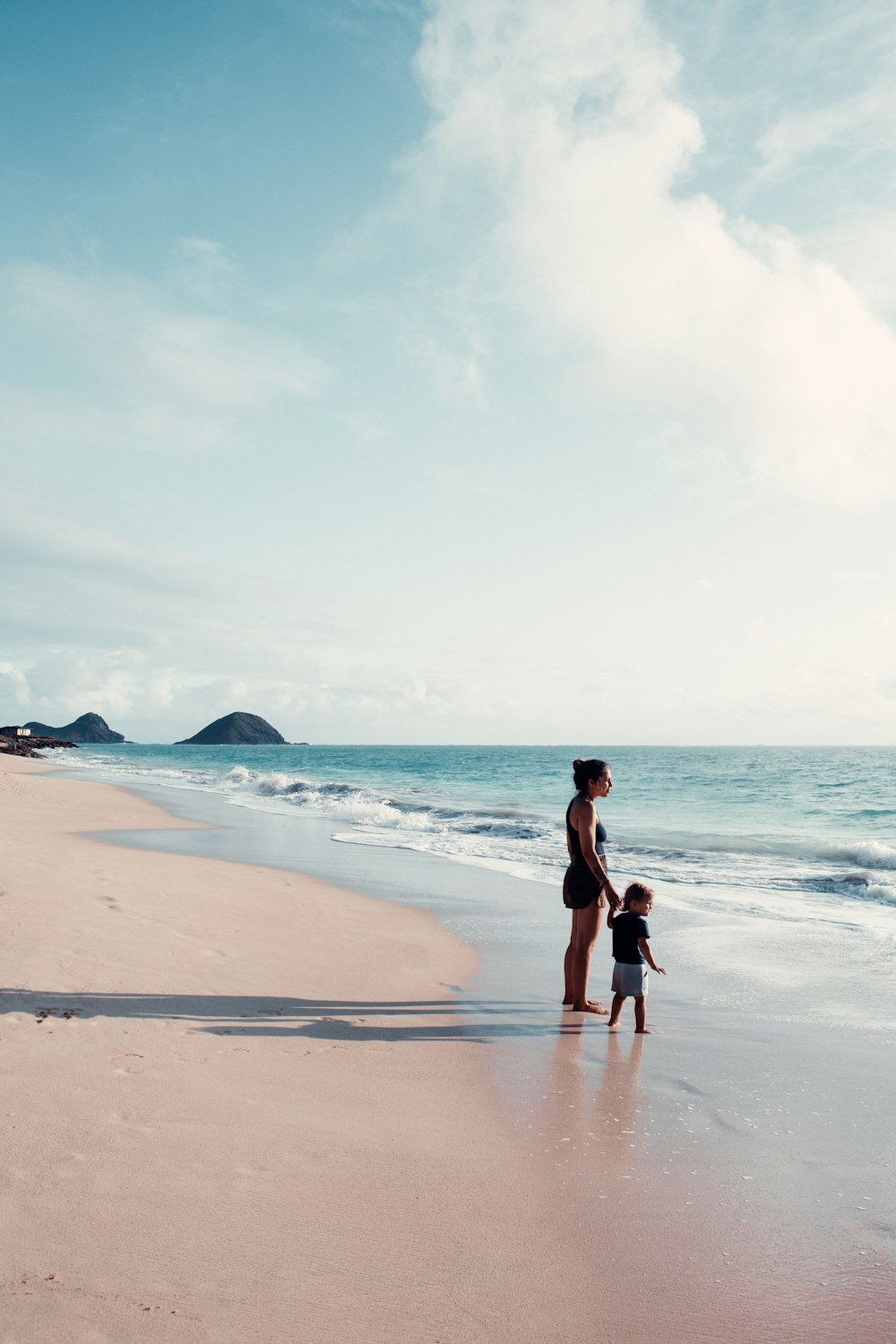 a person and a child on a beach