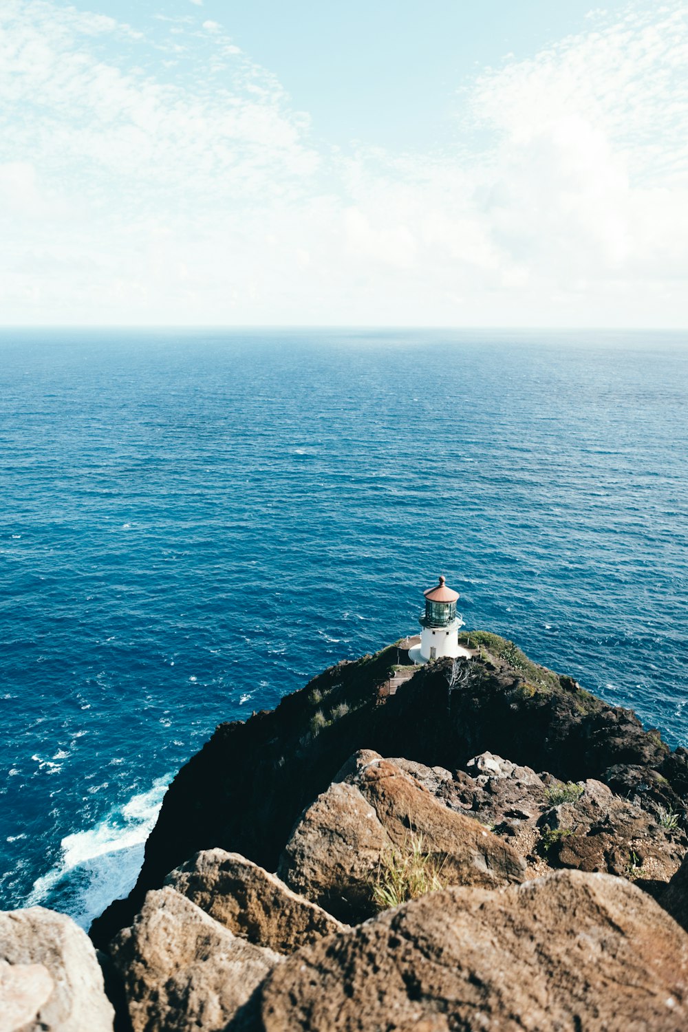 a lighthouse on a rocky cliff