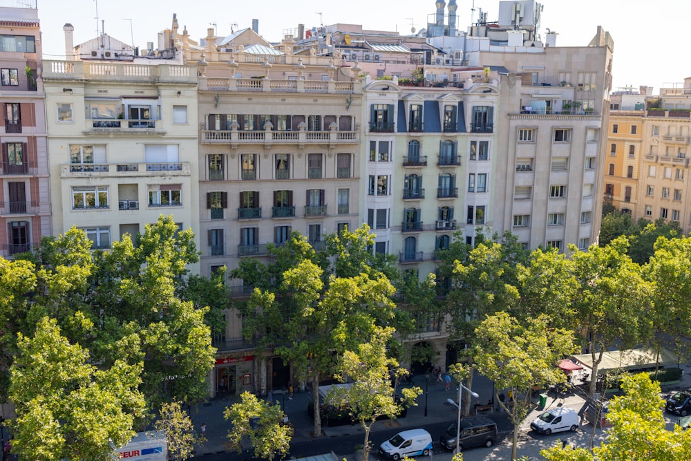 a group of buildings with trees in front of them