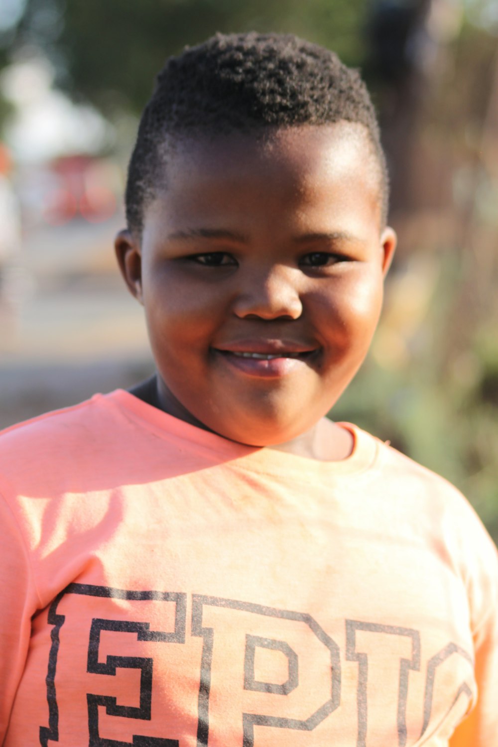 a boy smiling for the camera