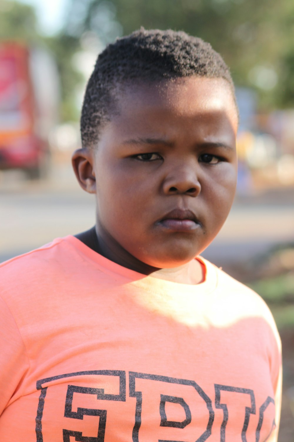 a young boy with a red shirt