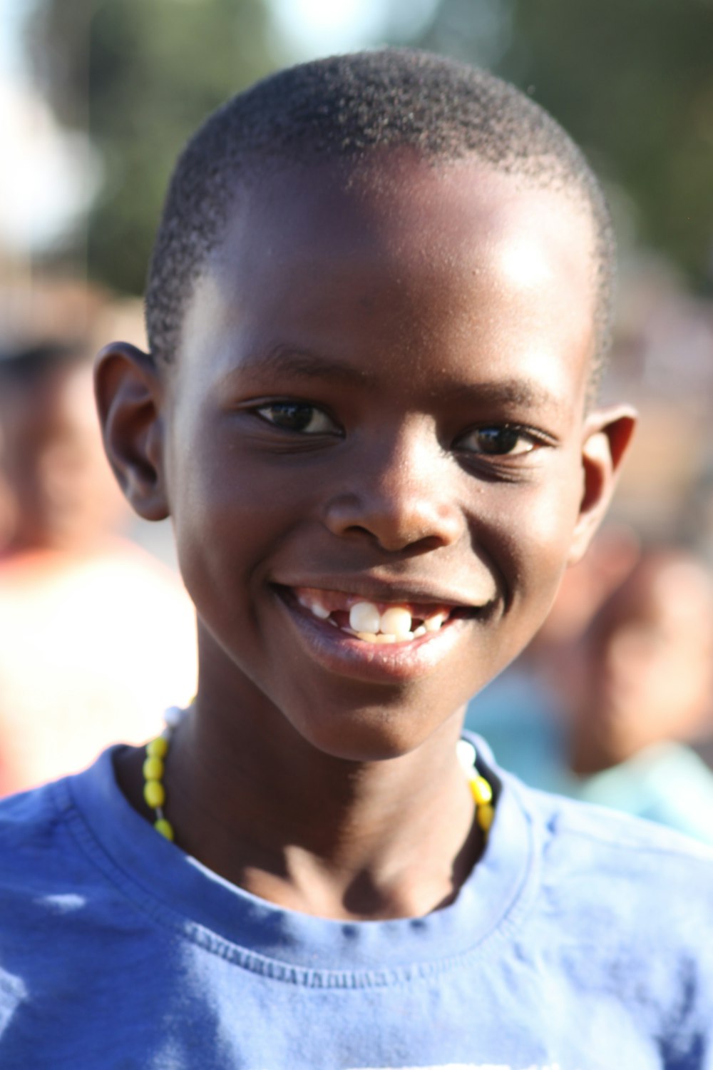 a close-up of a boy smiling