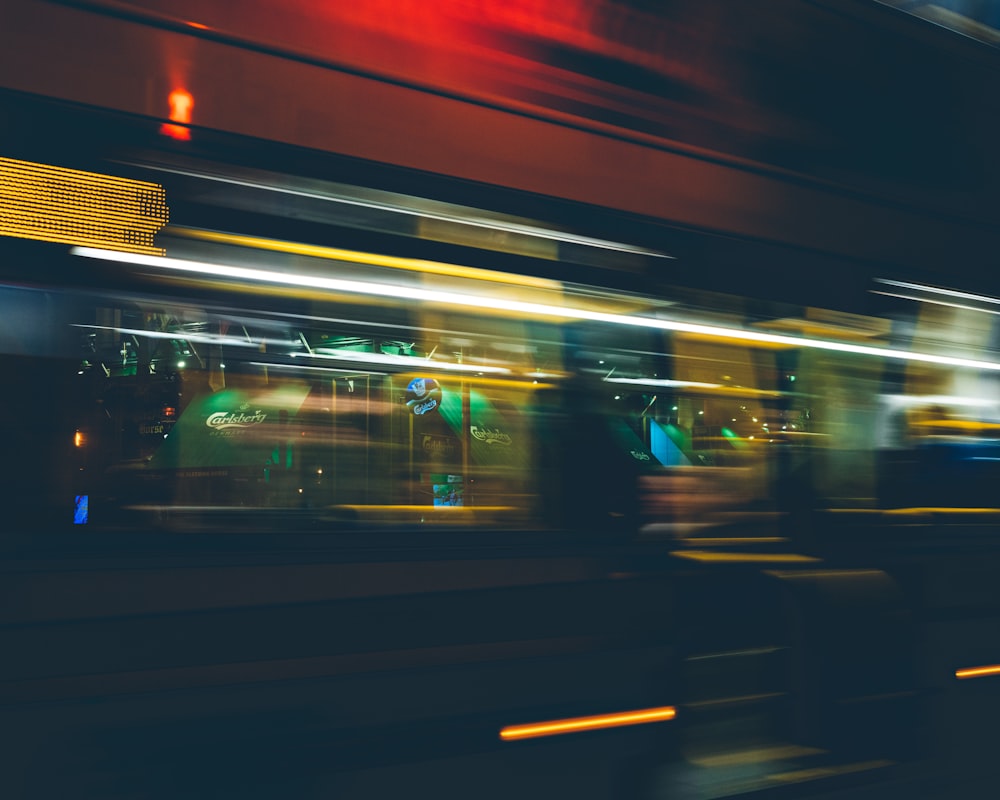 a blurry image of a city street at night